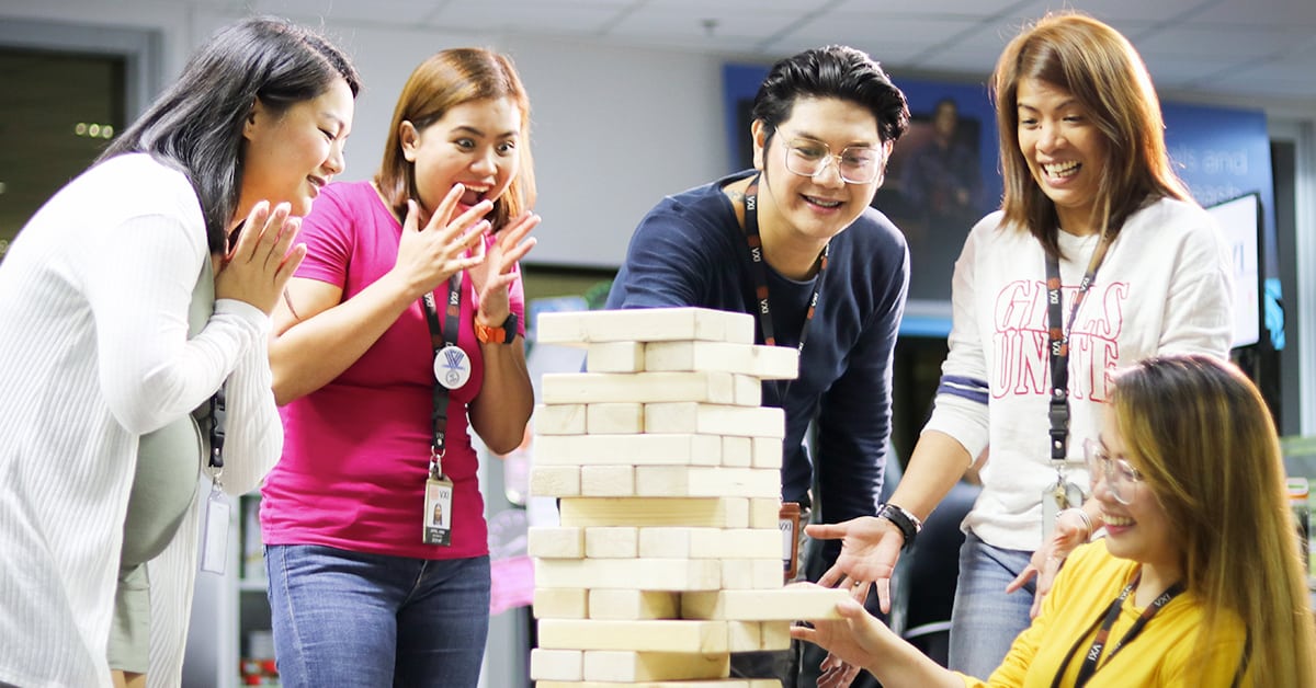 Group of VXI employees playing Jenga