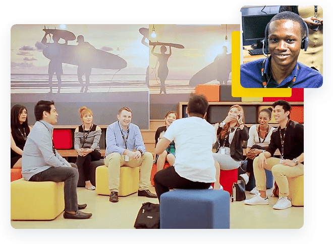 Photo of a group of people seated in a circle in a room, with an inset image of an agent wearing a headset.